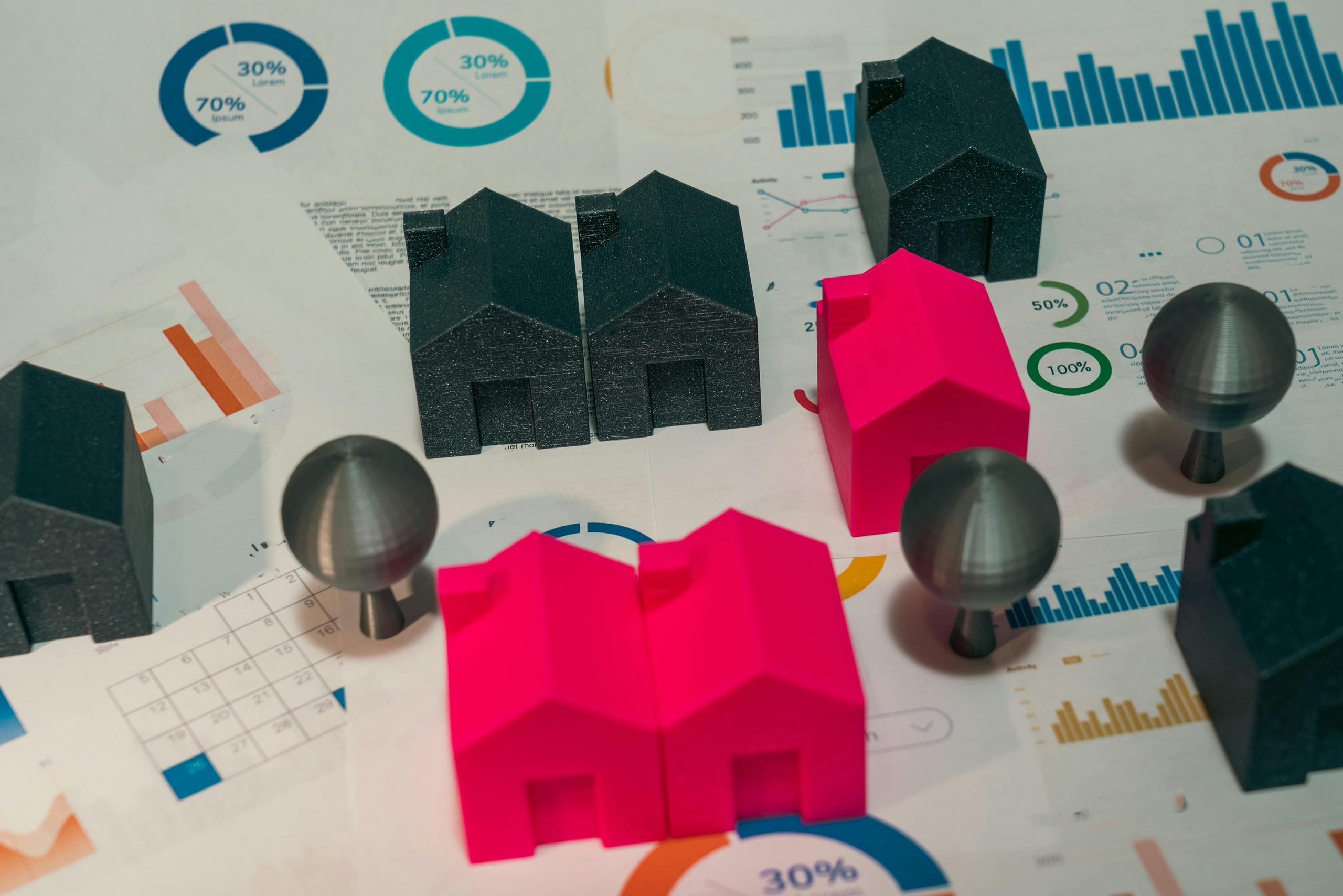 real estate market data and miniature houses